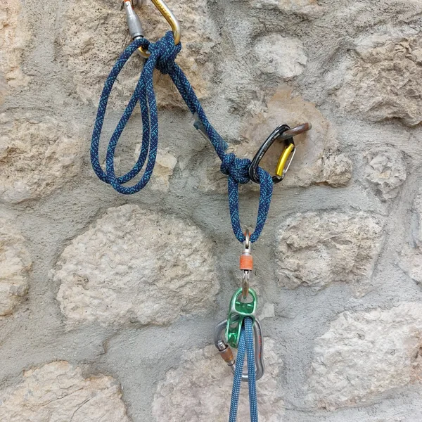 Belaying the second on a reverso from the belay station
